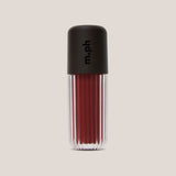 A single lip gloss bottle from the brand m.ph, featuring a ribbed clear glass body showing a deep berry red gloss and a matte black cap with the brand name printed vertically in black.
