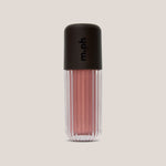 A ribbed clear cosmetic tube containing a shimmering dusty rose pink liquid, topped with a matte black cap featuring the vertical 'm.ph' logo, set against a solid light beige background.