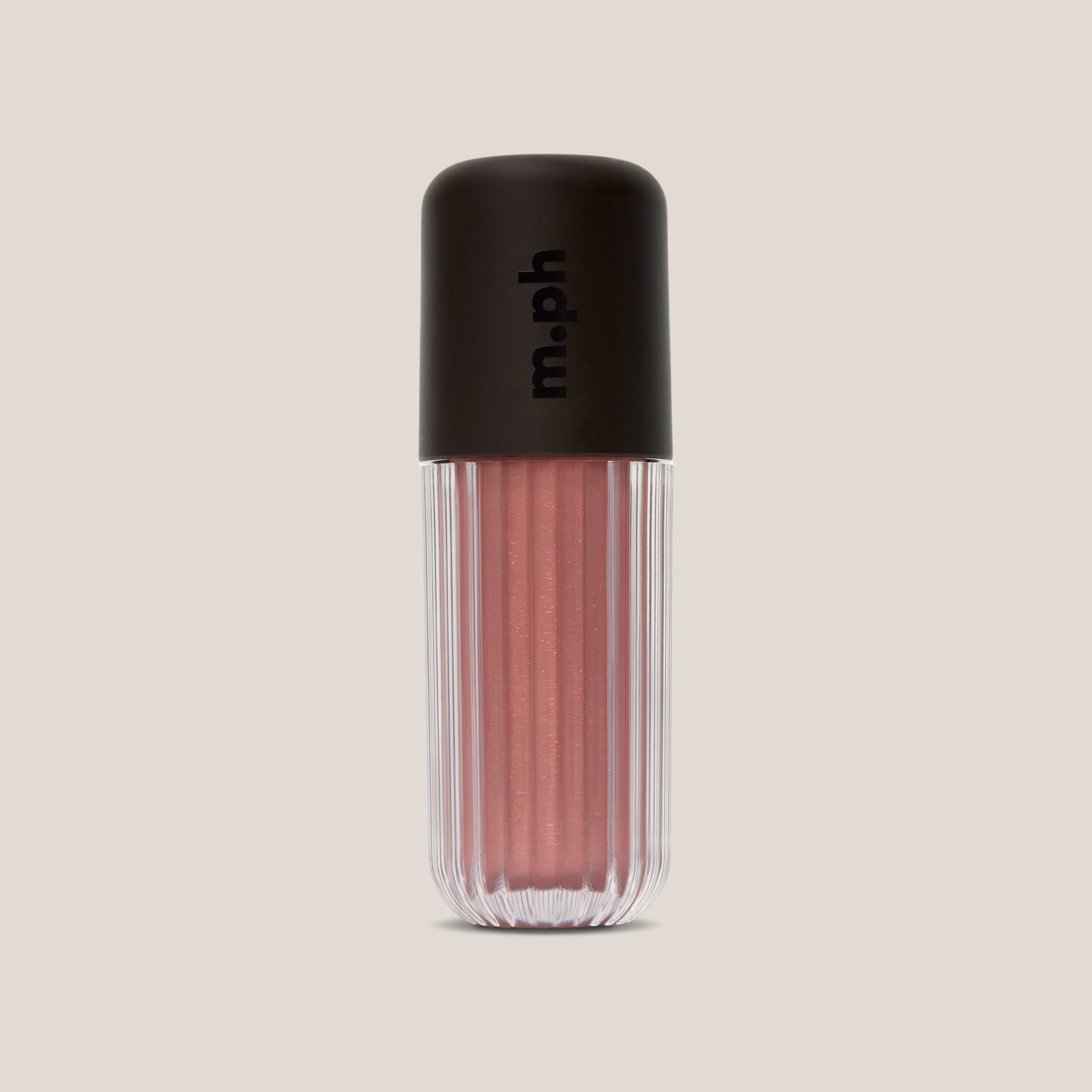 A ribbed clear cosmetic tube containing a shimmering dusty rose pink liquid, topped with a matte black cap featuring the vertical 'm.ph' logo, set against a solid light beige background.