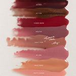 Image showing the Top Coat Hydrating Lip Gloss shade range with eight glossy swatches displayed from deepest to lightest. Shades include So Vain (deep rich plum), My Type (shimmering neutral brown), Cherry Bomb (vibrant berry red), Mouthy (shimmering rose mauve), Can't Stop (warm rose terracotta), My Girl (shimmering pink rose), Wild Thing (warm caramel nude), and Pretty Please (sheer soft peach with gold shimmer). A handwritten note from Mary points to Can't Stop, calling it "My favorite shade."