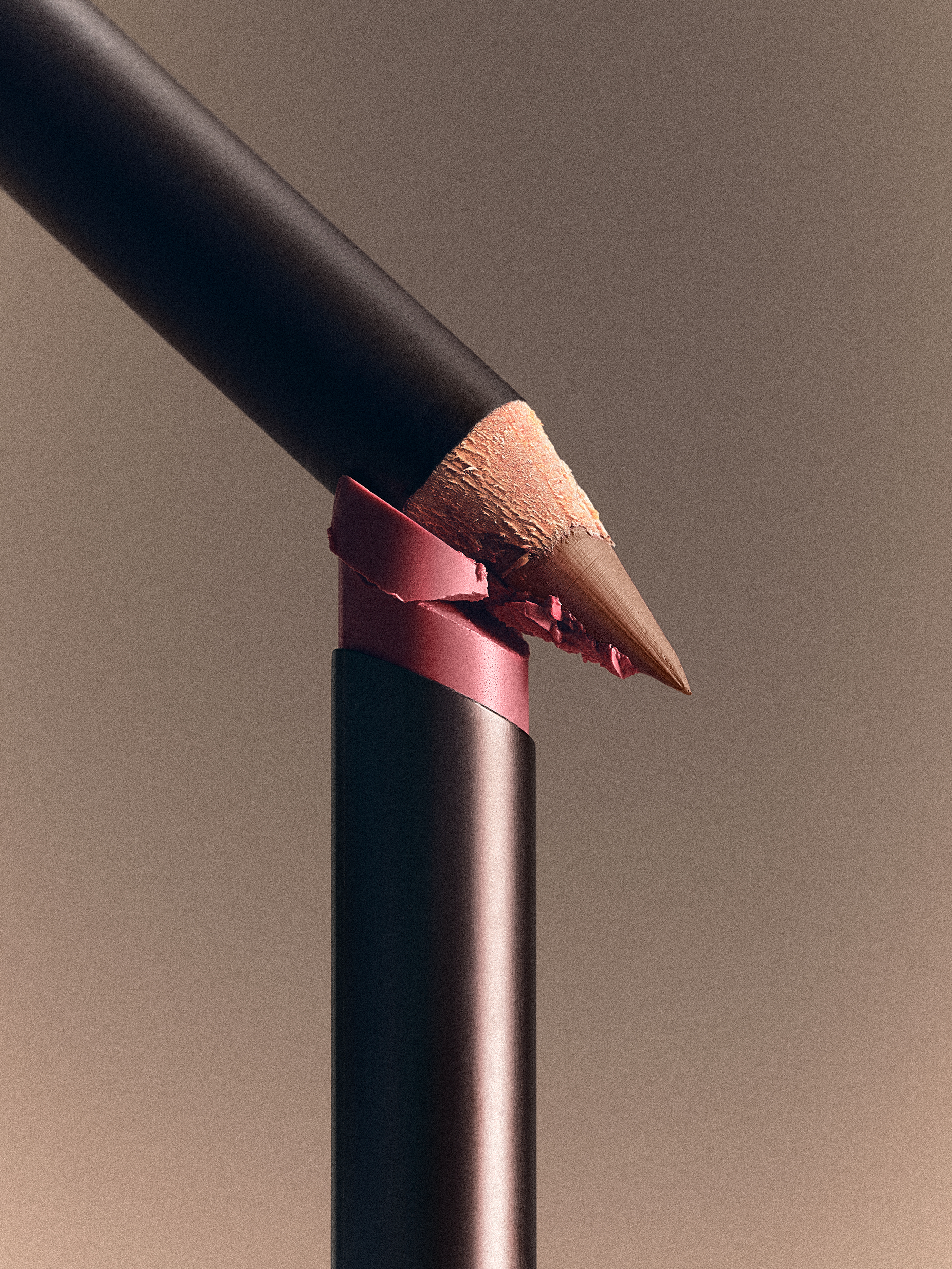 Lip liner pencil with pink tip on a gradient background