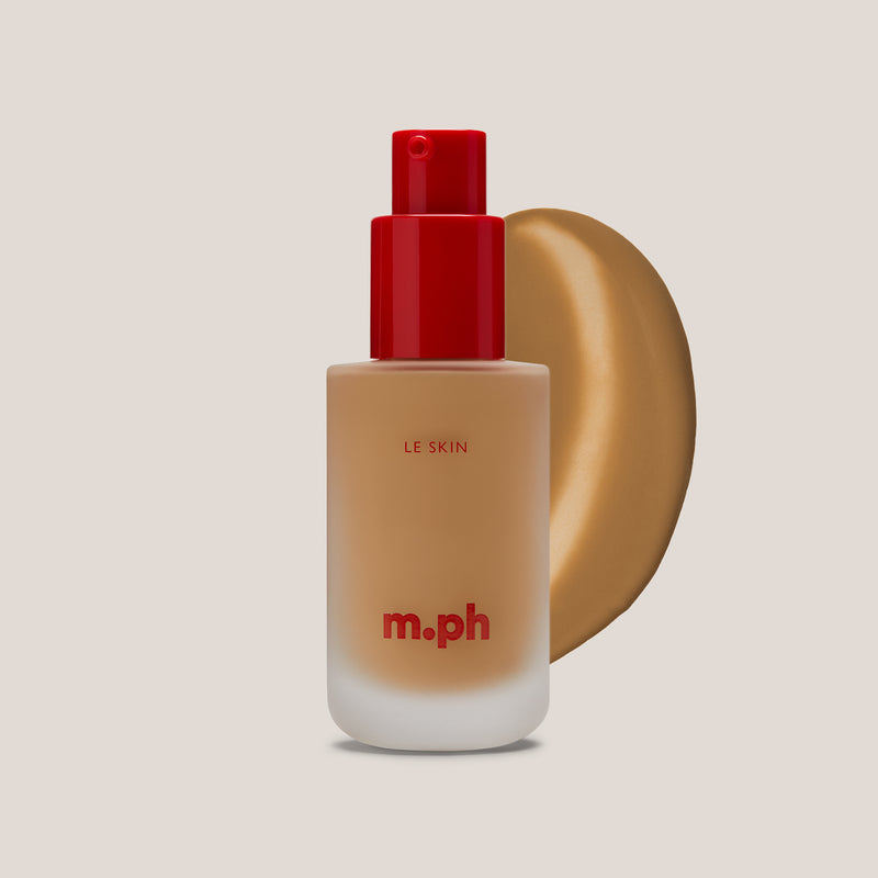m.ph Le Skin serum foundation bottle with a red cap, shown alongside a swatch of shade 210 on a beige background.