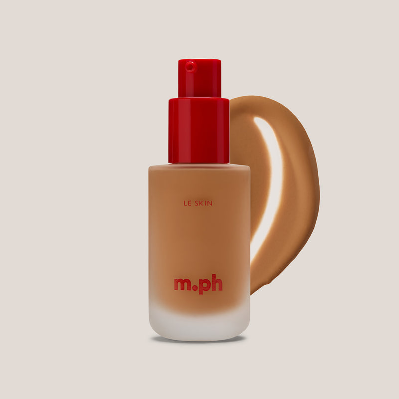 m.ph Le Skin foundation bottle with red pump cap and rich caramel swatch