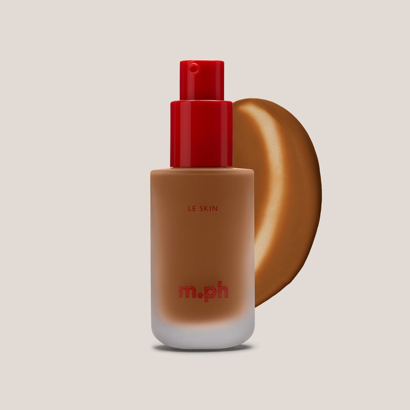 m.ph Le Skin long lasting makeup foundation bottle with red pump cap and deep toffee swatch