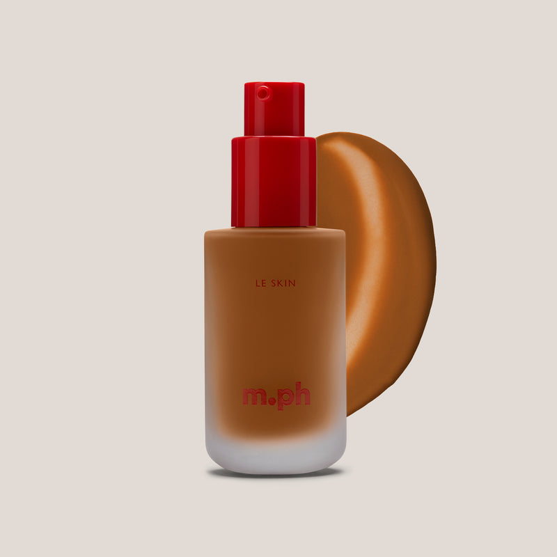 m.ph Le Skin weightless foundation bottle with red pump cap and deep cocoa swatch