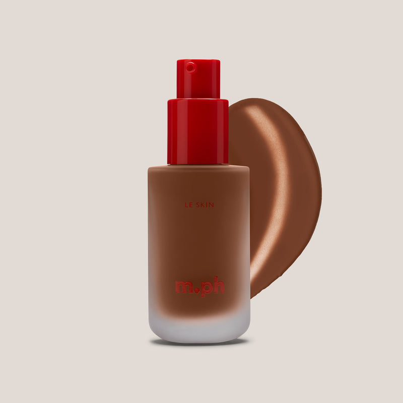 m.ph Le Skin full coverage foundation bottle with red pump cap and deep mocha swatch