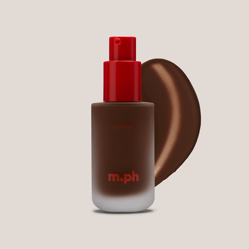 m.ph Le Skin deep complexion serum foundation bottle with red pump cap and rich walnut swatch