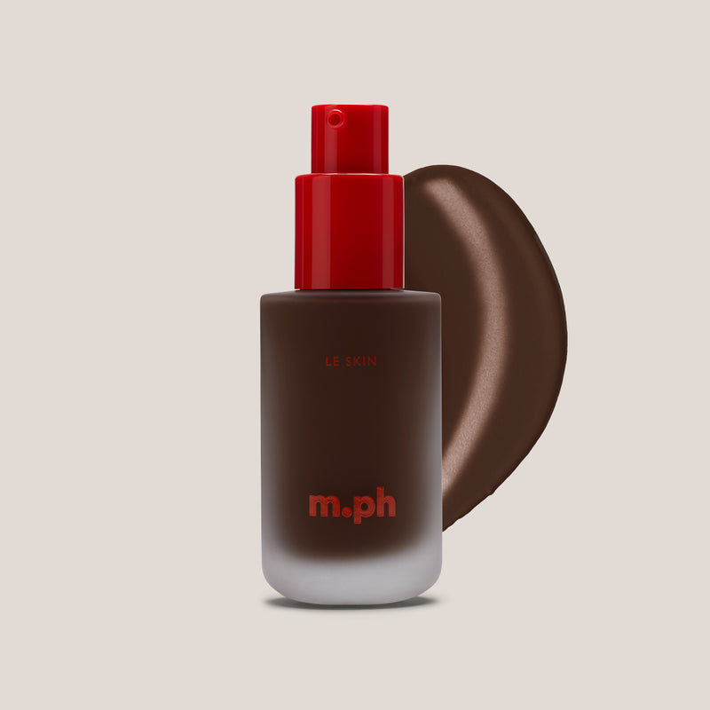 m.ph Le Skin dark toned hydrating foundation bottle with red pump cap and deep mahogany swatch