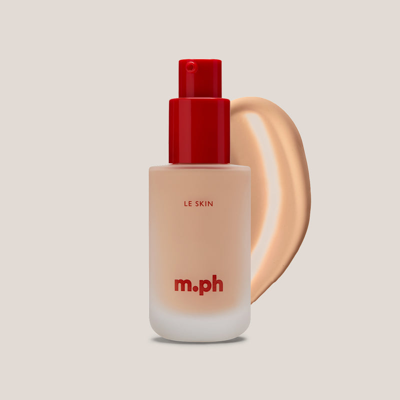 m.ph Le Skin skin foundation bottle with red pump cap and soft peach swatch