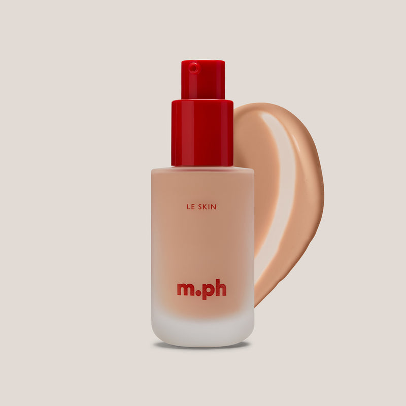 m.ph Le Skin peach beige liquid foundation bottle with red pump cap and natural sand swatch