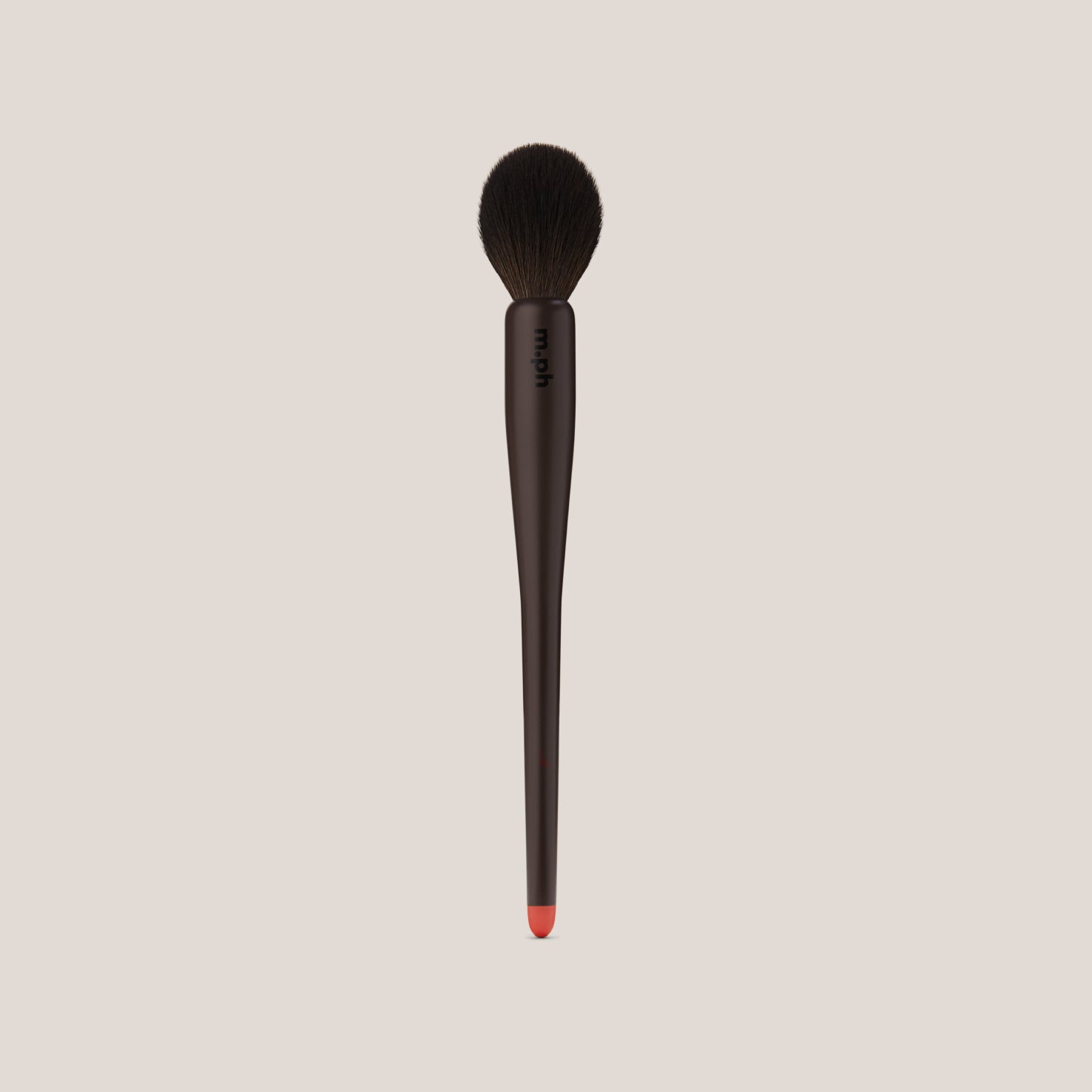 m.ph tapered powder makeup brush with dark brown handle and red tip on gray background