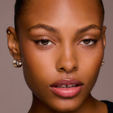 Close-up of a woman's face with a neutral background