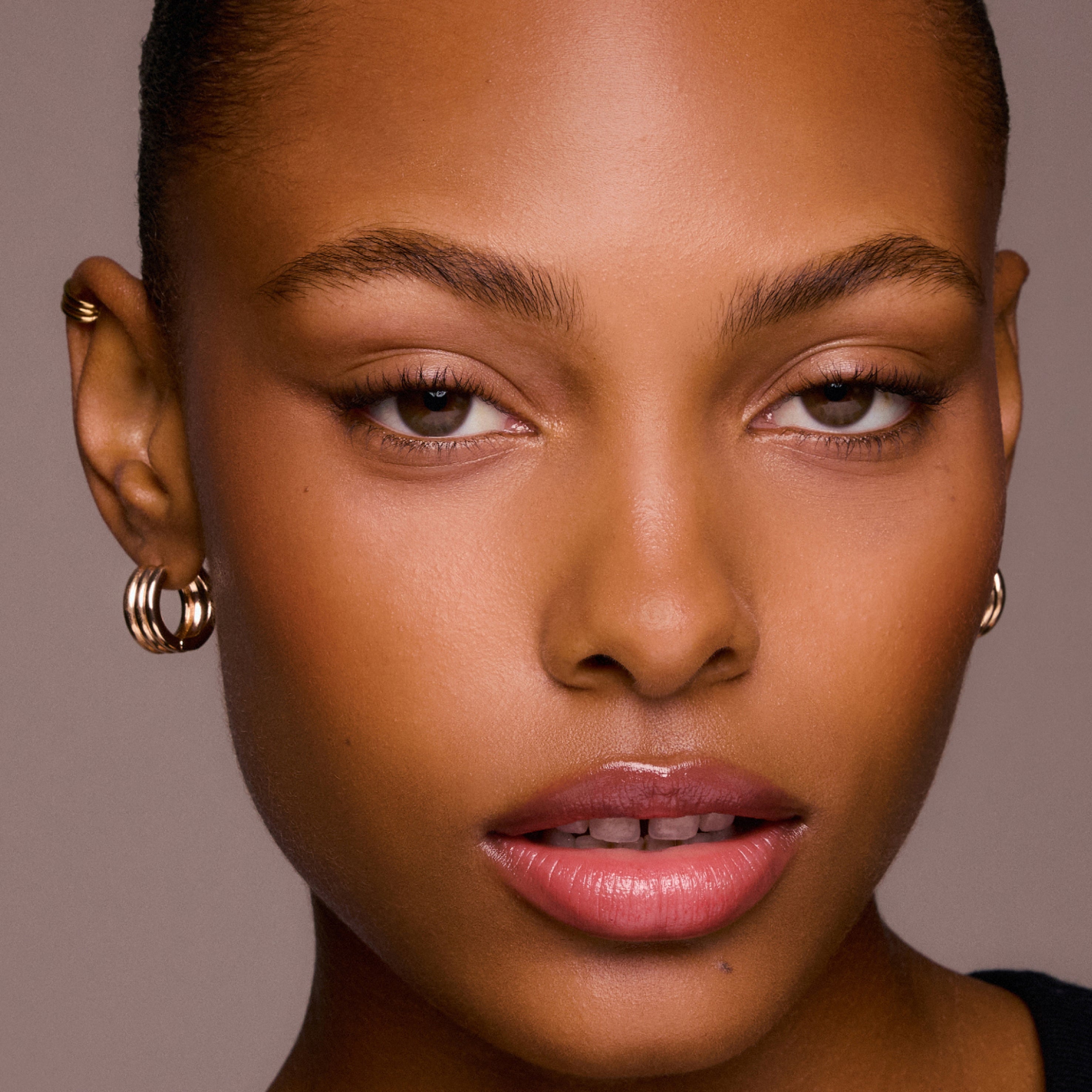 Close-up of a woman's face with a neutral background
