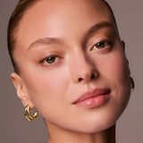 Close-up of a woman's face against a neutral background
