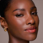 Close-up of a woman's face with a neutral background