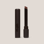 Lipstick with brown shade and 'm.ph' branding on a beige background