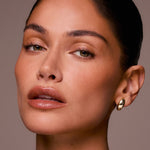 Close-up of a woman's face with a neutral background