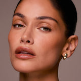 Close-up of a woman's face with a neutral background