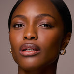 Close-up of a woman's face with a neutral background