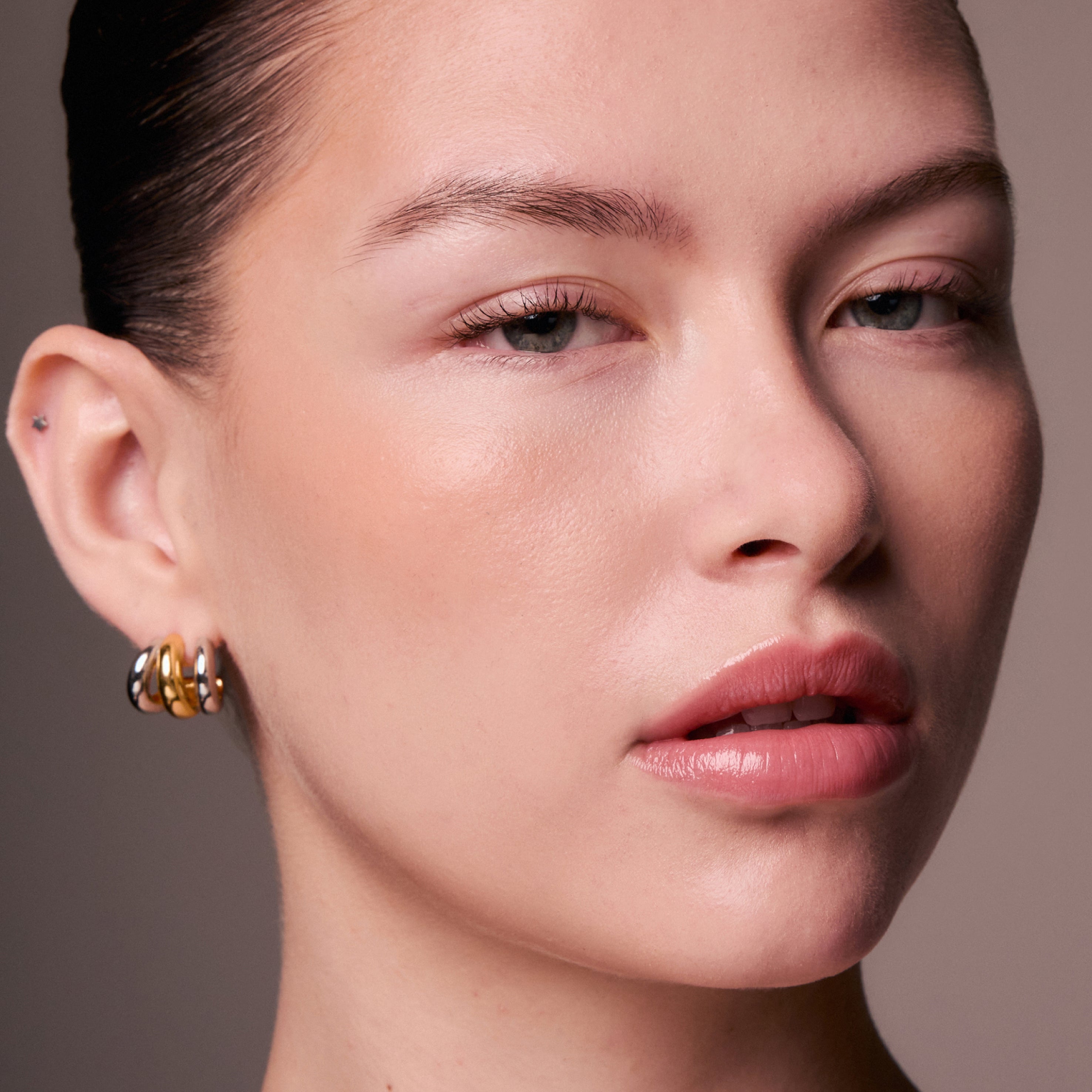 Close-up of a woman's face with a neutral background