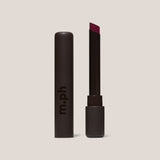 Red lipstick in black package on a white background