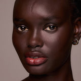 Close-up of a woman's face with a neutral background