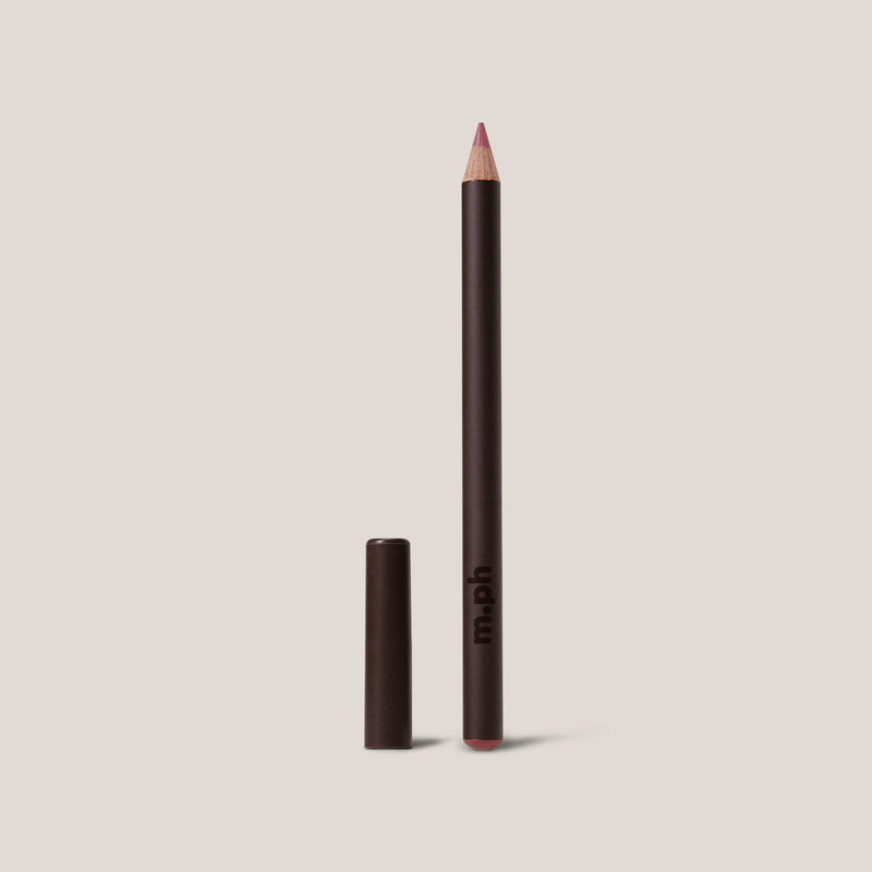 Lip liner pencil with cap on a beige background