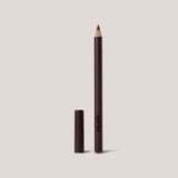 Lipliner pencil with cap on a beige background