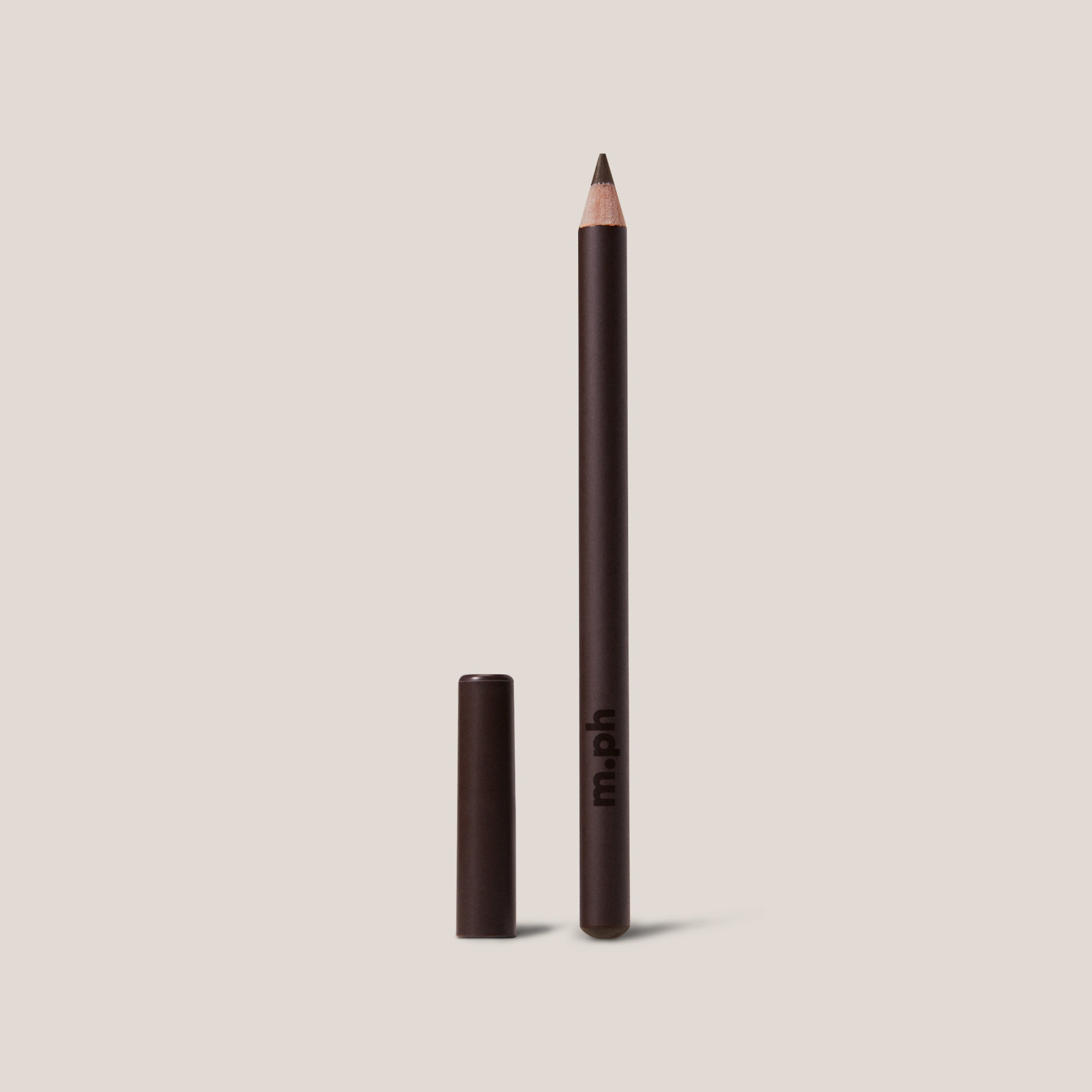 Lipliner pencil with cap on a beige background