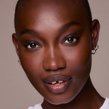 Close-up of a woman's face with a neutral background
