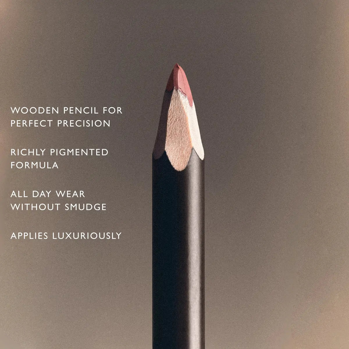 Sharpened wooden nude lip liner pencil with richly pigmented mauve tip for precise, all-day definition.