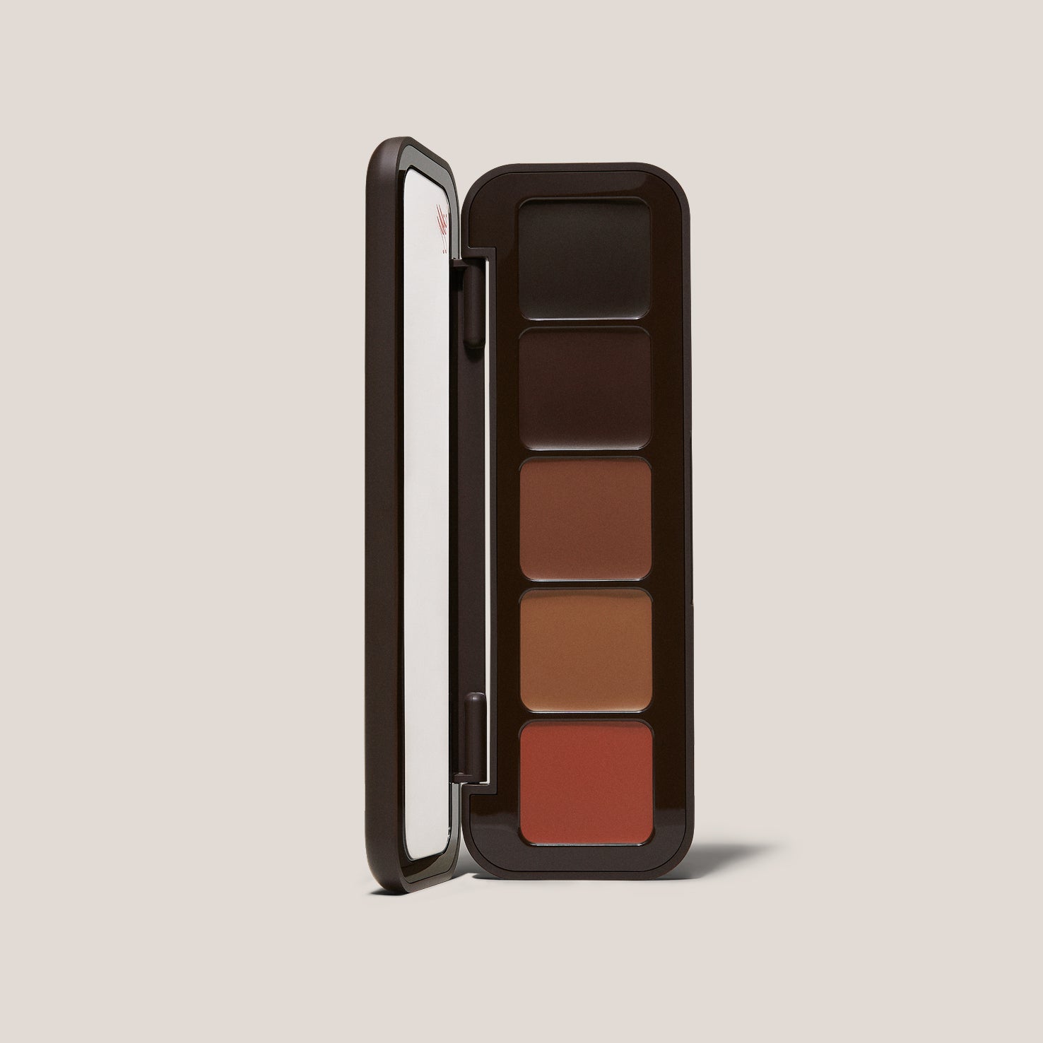 Open Underpainting face palette in Deep Rich with five cream shades and mirrored lid.